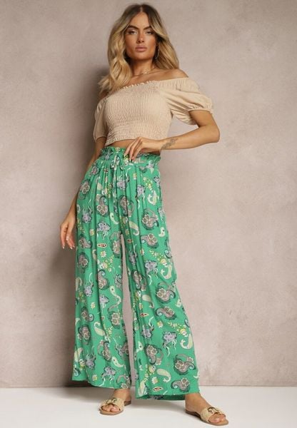 Zielone Bawełniane Spodnie Boho w Stylu Palazzo z Gumką w Pasie i Wysokim Stanem Pravia. Zielone spodnie materiałowe damskie Renee, bez wzorów, z bawełny. Za 49.99 zł.