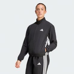 Kurtka Train Essentials 3-Stripes Woven Warm-Up. Czarne kurtki damskie Adidas, bez wzorów, z puchu, bez kaptura. Za 186.99 zł.