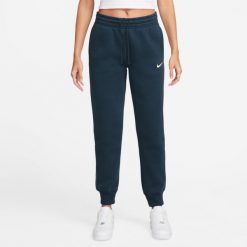 Spodnie sportowe damskie Nike Nsw Phnx Flc. Niebieskie spodnie sportowe damskie Nike, bez wzorów, z dresówki. Za 405.00 zł.
