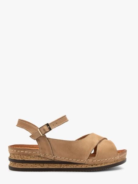 Beżowe sandały damskie z platformą. Brązowe sandały damskie Ryłko, bez wzorów, ze skóry, bez obcasa, na platformie, bez zapięcia. Za 359.99 zł.