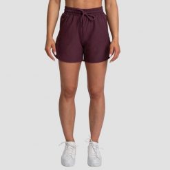 Szorty damskie fitness regular z kieszeniami bakłażanowe TRN. Czerwone spodenki sportowe damskie GYMBEAM, l, bez wzorów, z elastanu, do biegania. Za 75.90 zł.