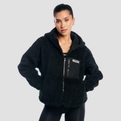 Kurtka damska fitness z kapturem oversize Sherpa. Czarne kurtki damskie GYMBEAM, xs, bez wzorów, z materiału, z kapturem. Za 188.90 zł.