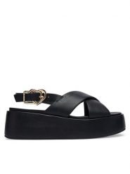 LOVE MOSCHINO Sandały JA16137I0OIA0000 Czarny. Czarne sandały damskie Love Moschino, bez wzorów, ze skóry, bez obcasa, na koturnie, bez zapięcia. Za 706.99 zł.