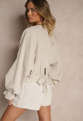 Beżowa Bawełniana Bluzka Typu Nietoperz z Wiązaniem Sepionna. Brązowe bluzki damskie Renee, bez wzorów, z bawełny, eleganckie, bez kołnierzyka, bez ramiączek. Za 99.99 zł.