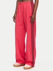 Adidas Spodnie dresowe Firebird Loose Tracksuit KW0228 Różowy Loose Fit. Czerwone spodnie dresowe damskie Adidas, s, bez wzorów, z dresówki. Za 299.99 zł.