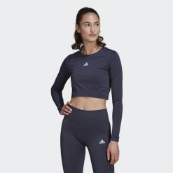 Koszulka damska adidas Aeroknit Seamless Fitted Cropped. Białe koszulki damskie Adidas, s, bez wzorów, z materiału, bez kołnierzyka, bez ramiączek. Za 102.00 zł.