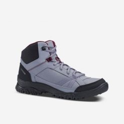 Buty turystyczne damskie Quechua NH100 mid. Brązowe obuwie trekkingowe damskie QUECHUA, z syntetyku, przed kolano, bez zapięcia. Za 89.99 zł.
