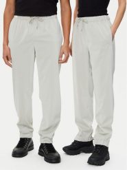 Rains Spodnie przeciwdeszczowe Unisex 18560 Beżowy Regular Fit. Brązowe spodnie sportowe damskie Rains, s, bez wzorów, z syntetyku, żeglarskie. Za 169.99 zł.