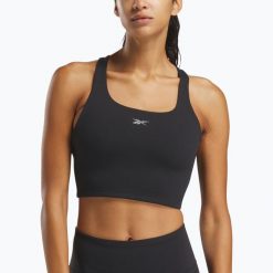 Koszulka Reebok Lux Tank. Czarne koszulki damskie REEBOK FITNESS, bez wzorów, bez kołnierzyka, bez ramiączek. Za 179.99 zł.