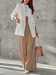 Milan Kiss Spodnie w kolorze kremowo-brązowym rozmiar: XL. Brązowe spodnie materiałowe damskie Milan Kiss, bez wzorów, z bawełny. Za 165.99 zł.