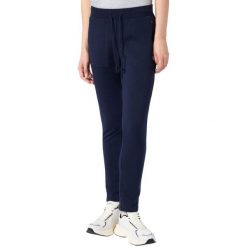 Spodnie damskie Champion Slim Pants. Niebieskie spodnie materiałowe damskie Champion, bez wzorów, z bawełny. Za 154.99 zł.