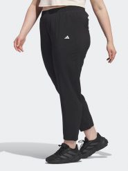 Adidas Spodnie sportowe w kolorze czarnym rozmiar: 4X. Czarne spodnie dresowe damskie Adidas, bez wzorów, z materiału, outdoorowe. Za 127.35 zł.