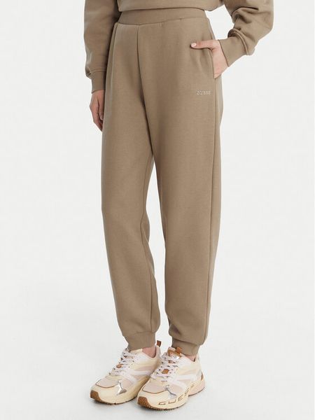 Guess Spodnie dresowe V6RB15 K9V31 Beżowy Regular Fit. Brązowe spodnie dresowe damskie Guess, l, z aplikacjami, z bawełny. Za 299.99 zł.