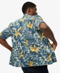 Superdry Koszula Hawaiian Printed z bawełną i modalem. Niebieskie koszule damskie Superdry, na lato, m, bez wzorów, z bawełny, klasyczne, bez kołnierzyka, bez ramiączek. Za 287.75 zł.