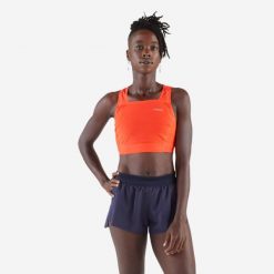 Koszulka do biegania bez rękawów damska Kiprun 900 Light crop top. Brązowe koszulki damskie KIPRUN, m, bez wzorów, z elastanu, bez kołnierzyka, bez ramiączek. W wyprzedaży za 89.99 zł.