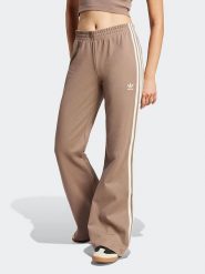 Adidas Spodnie dresowe w kolorze beżowym rozmiar: M. Brązowe spodnie dresowe damskie Adidas, m, bez wzorów, z dresówki. Za 208.83 zł.