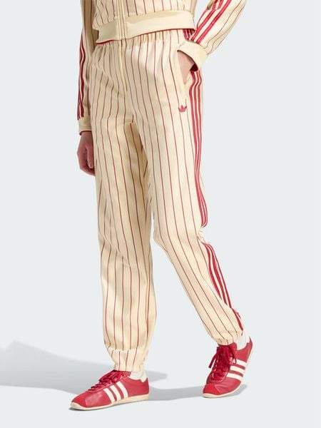 Adidas Spodnie dresowe Pinstripe Firebird Track Ptan KT1851 Kremowy Regular Fit. Białe spodnie dresowe damskie Adidas, xs, bez wzorów, z dresówki. Za 319.99 zł.