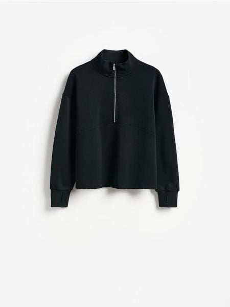 Bluza z dodatkiem modalu - czarny. Czarne bluzy damskie Reserved, l, bez wzorów, z dzianiny, bez kaptura. Za 129.99 zł.