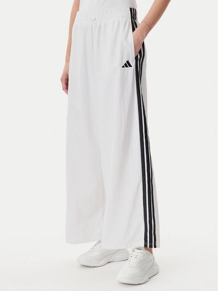 Adidas Spodnie dresowe Essentials 3-Stripes JE1307 Biały Loose Fit. Białe spodnie dresowe damskie Adidas, l, bez wzorów, z dresówki. Za 139.99 zł.