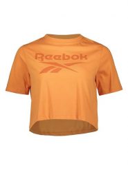 Reebok Koszulka w kolorze pomarańczowym rozmiar: L. Pomarańczowe bluzki damskie Reebok, l, bez wzorów, bez kołnierzyka, bez ramiączek. Za 70.45 zł.