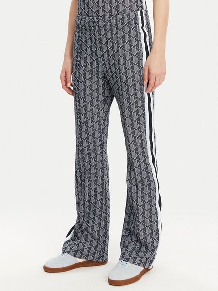 Lacoste Spodnie dresowe XF9313 Granatowy Regular Fit. Niebieskie spodnie dresowe damskie Lacoste, bez wzorów, z bawełny. Za 389.99 zł.