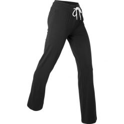 Spodnie z dżerseju z bawełny ze stretchem. Czarne spodnie sportowe damskie bonprix, bez wzorów, z bawełny, na fitness i siłownię. Za 77.99 zł.
