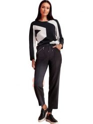 Heine Spodnie dresowe w kolorze czarnym rozmiar: 40. Czarne spodnie dresowe damskie Heine, bez wzorów, z dresówki. Za 109.52 zł.