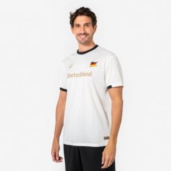 Koszulka piłkarska Niemcy dla kibiców. Białe bluzki damskie KIPSTA, l, bez wzorów, z materiału, sportowe, bez kołnierzyka, bez ramiączek. Za 44.99 zł.