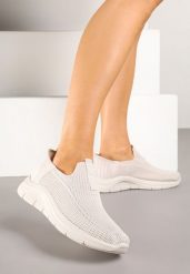 Jasnobeżowe Wsuwane Buty Sportowe Sneakersy na Tłoczonej Podeszwie Fadema. Brązowe obuwie sportowe casual damskie Born2be, bez zapięcia. Za 69.99 zł.