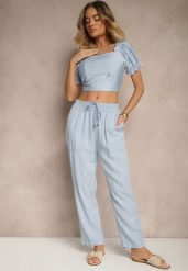 Jasnoniebieskie Spodnie z Bawełną High Waist Ozdobione Wiązaniem Calwia. Niebieskie spodnie materiałowe damskie Renee, bez wzorów, z bawełny. Za 49.99 zł.