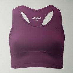 Crop top sportowy treningowy FEBE. Fioletowe biustonosze sportowe damskie LEGEA, bez wzorów, z materiału. W wyprzedaży za 84.50 zł.