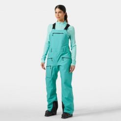 Kombinezony damskie Helly Hansen Powderqueen. Zielone kombinezony damskie Helly Hansen, na zimę, m, bez wzorów, sportowe, bez kołnierzyka, bez ramiączek. W wyprzedaży za 1,207.50 zł.