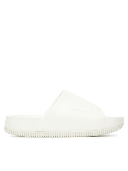 Nike Klapki Calm Slide DX4816 100 Biały. Białe klapki damskie Nike, bez wzorów, z syntetyku, bez obcasa, bez zapięcia. Za 181.46 zł.