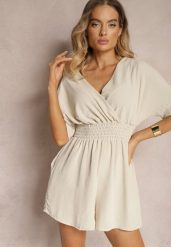 Beżowy Kombinezon Kopertowy z Gumką w Pasie Fandrea. Brązowe sukienki damskie Renee, bez wzorów, z jeansu, eleganckie, bez ramiączek. W wyprzedaży za 51.99 zł.