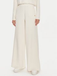 Guess Spodnie dresowe Olympe V4YB07 KCAY2 Beżowy Relaxed Fit. Brązowe spodnie dresowe damskie Guess, m, z aplikacjami, z dresówki. Za 269.99 zł.