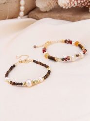 Pierres de Jade Pozłacane bransoletki (2 szt.) z perłami i kamieniami szlachetnymi rozmiar: onesize. Białe bransoletki damskie Pierres de Jade, pozłacane. Za 43.99 zł.