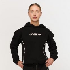 Bluza damska fitness z kapturem czarna Varsity. Czarne bluzy damskie GYMBEAM, m, bez wzorów, z bawełny, z kapturem. Za 139.90 zł.
