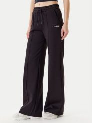 Guess Spodnie dresowe V5YB03 KCX22 Czarny Regular Fit. Czarne spodnie dresowe damskie Guess, m, z aplikacjami, z dresówki. Za 279.99 zł.
