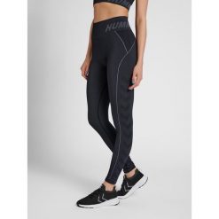 Damskie legginsy ze średnim stanem Hummel TE Christel. Czarne legginsy sportowe damskie Hummel, xs, bez wzorów, z dzianiny, na fitness i siłownię. Za 156.00 zł.