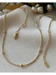 Luseera Pozłacany naszyjnik z elementami ozdobnymi - dł. 45 cm rozmiar: onesize. Żółte naszyjniki damskie Luseera, pozłacane. Za 43.99 zł.