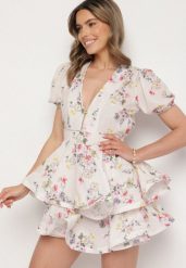 Biała Bawełniana Sukienka w Kwiaty o Rozkloszowanym Kroju z Falbankami Norittia. Białe sukienki damskie Born2be, bez wzorów, z bawełny, eleganckie, bez ramiączek. W wyprzedaży za 144.49 zł.