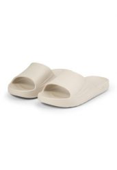 Klapki basenowe damskie Fila Off-Crt Slide wsuwane. Białe klapki damskie Fila, bez wzorów, z materiału, bez obcasa, bez zapięcia. Za 69.00 zł.