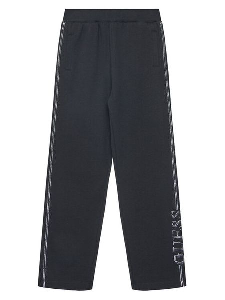 Guess Spodnie dresowe J5YQ12 KA6R4 Czarny Regular Fit. Czarne spodnie dresowe dziewczęce Guess, z aplikacjami, z bawełny. Za 119.99 zł.
