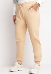 Beżowe Spodnie Dresowe Joggery z Wsuwanymi Kieszeniami Davidora. Brązowe spodnie dresowe damskie Born2be, xl, bez wzorów, z dresówki. Za 24.99 zł.
