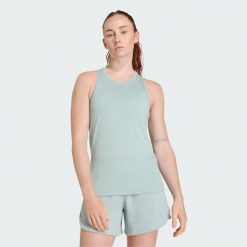 Koszulka treningowa bez rękawów Designed for Training. Zielone koszulki damskie Adidas, bez wzorów, z materiału, bez kołnierzyka, bez ramiączek. Za 149.00 zł.