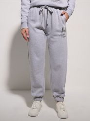Spodnie jogger Minnie Mouse - szary. Szare spodnie sportowe damskie Sinsay, l, bez wzorów. Za 39.99 zł.