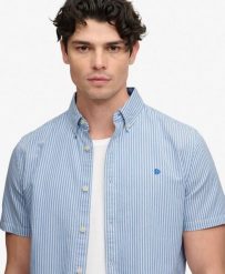 Superdry Koszula Preppy Oxford krótki rękaw – 100% Bawełna organiczna, luźny. Niebieskie koszule damskie Superdry, xl, bez wzorów, z bawełny, klasyczne, bez kołnierzyka, bez ramiączek. Za 282.85 zł.