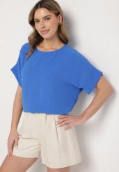 Niebieska Bluzka o Kroju Nietoperza Faderia. Niebieskie bluzki damskie Born2be, l, bez wzorów, z materiału, klasyczne, bez kołnierzyka, bez ramiączek. Za 39.99 zł.