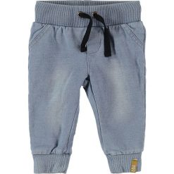 Spodnie dresowe w kolorze błękitnym. Niebieskie spodnie niemowlęce Beebielove, z bawełny. W wyprzedaży za 37.95 zł.