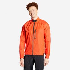 Kurtka przeciwdeszczowa rowerowa MTB Rockrider Comfort 500. Czerwone kurtki damskie ROCKRIDER, l, bez wzorów, z materiału, bez kaptura. Za 159.99 zł.